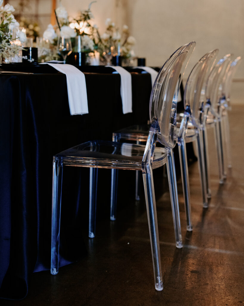 The Editorial Experience Styled Shoot: Tablescape set-up with clear chairs