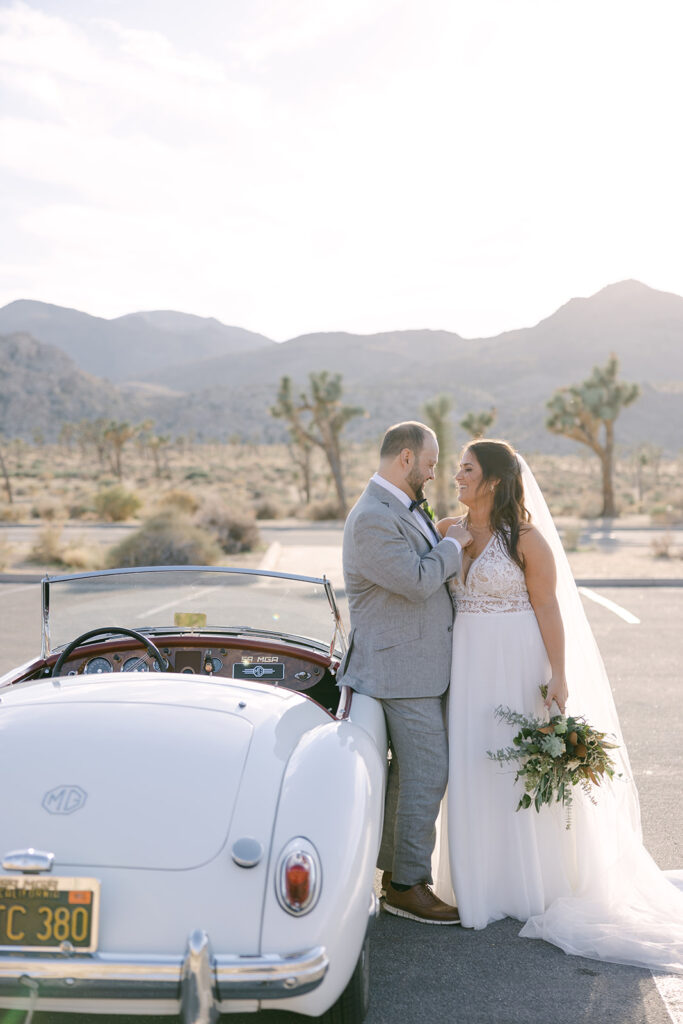 Cameron and Rick enjoying their first ride as husband and wife in a classic MGA from Coachella Valley Cars 