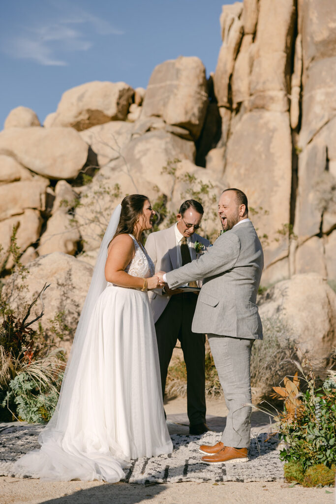 Cameron + Rick enjoying their vows during their ceremony in Joshua Tree