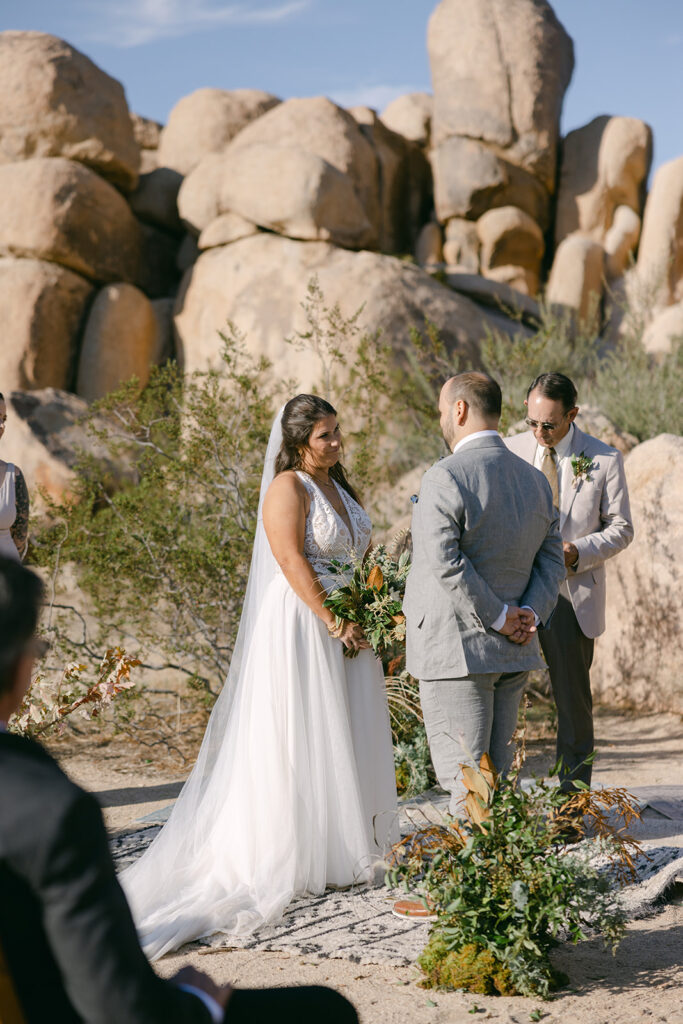 Cameron + Rick meeting at the altar during ceremony in Joshua Tree