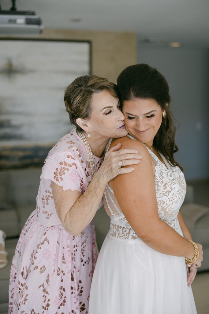 Cameron and her mother getting ready together before her wedding ceremony