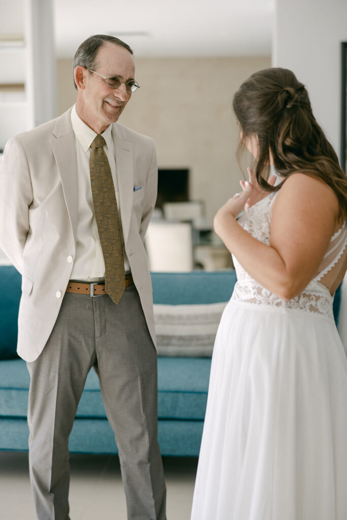 Cameron and her father enjoying their first look before her wedding ceremony